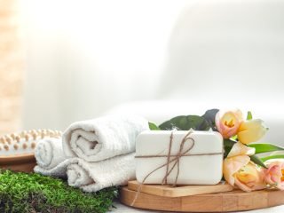 Spring Spa composition with body care items with fresh tulips on a light background, beauty and health .